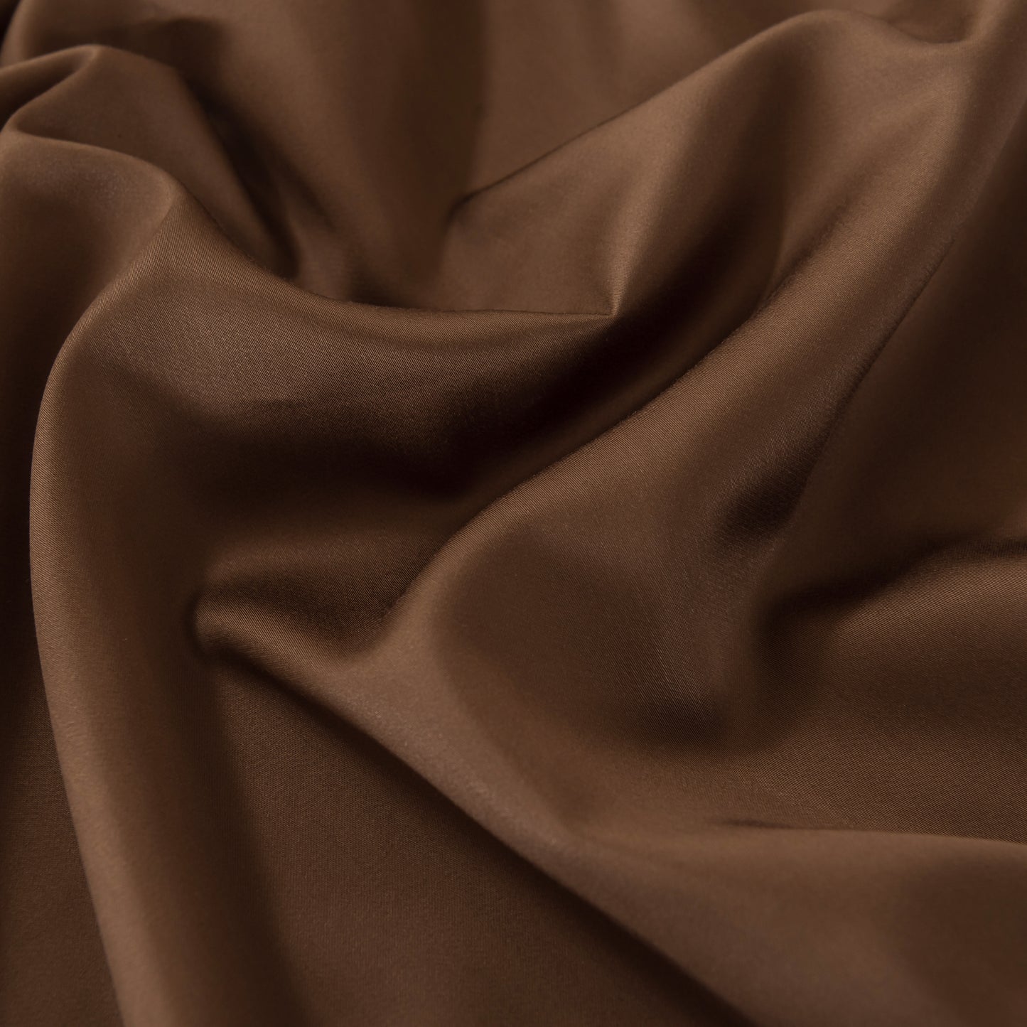 Close-up of soft brown bamboo fabric with folds