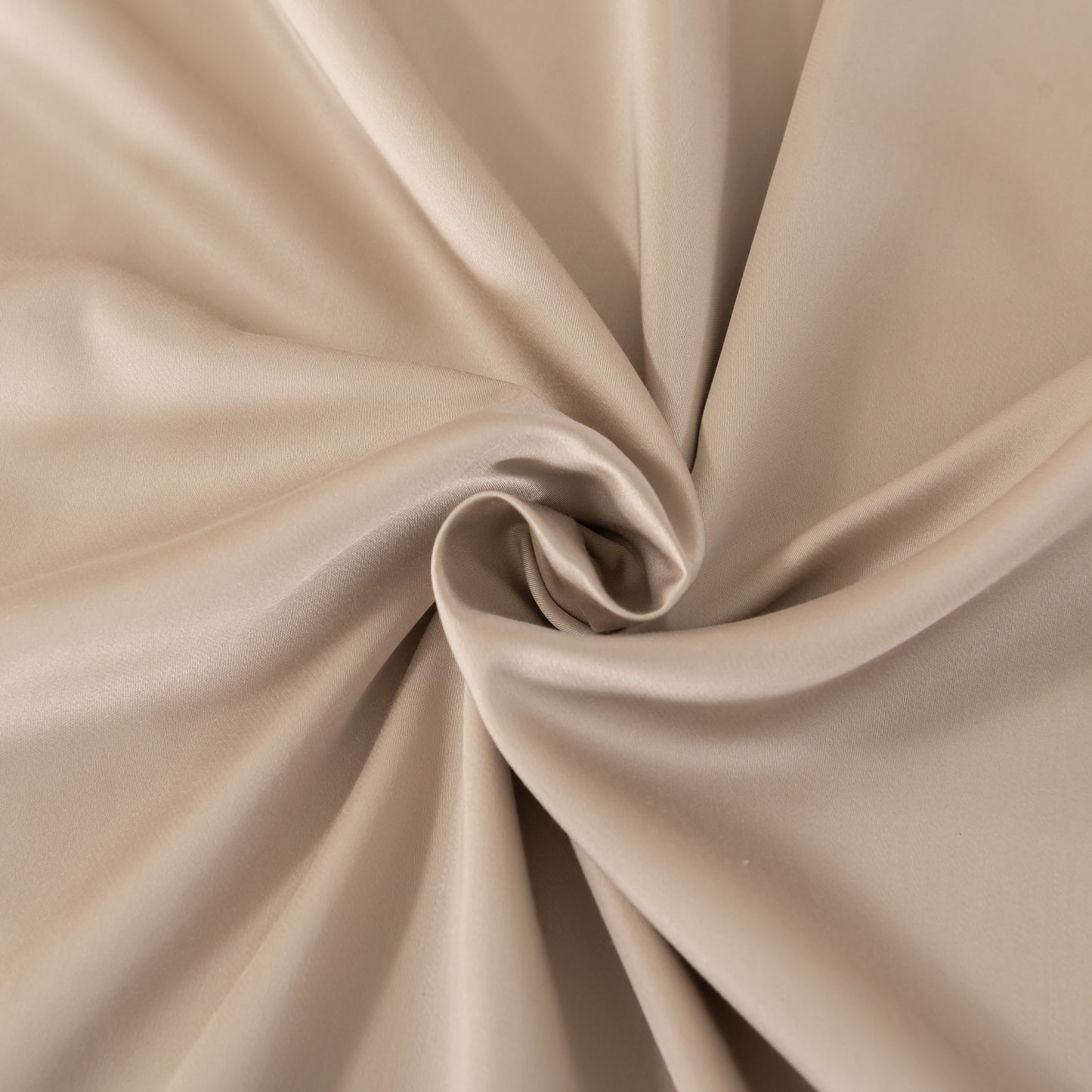 Close-up of beige fabric with folds