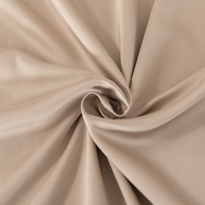 Close-up of beige fabric with folds