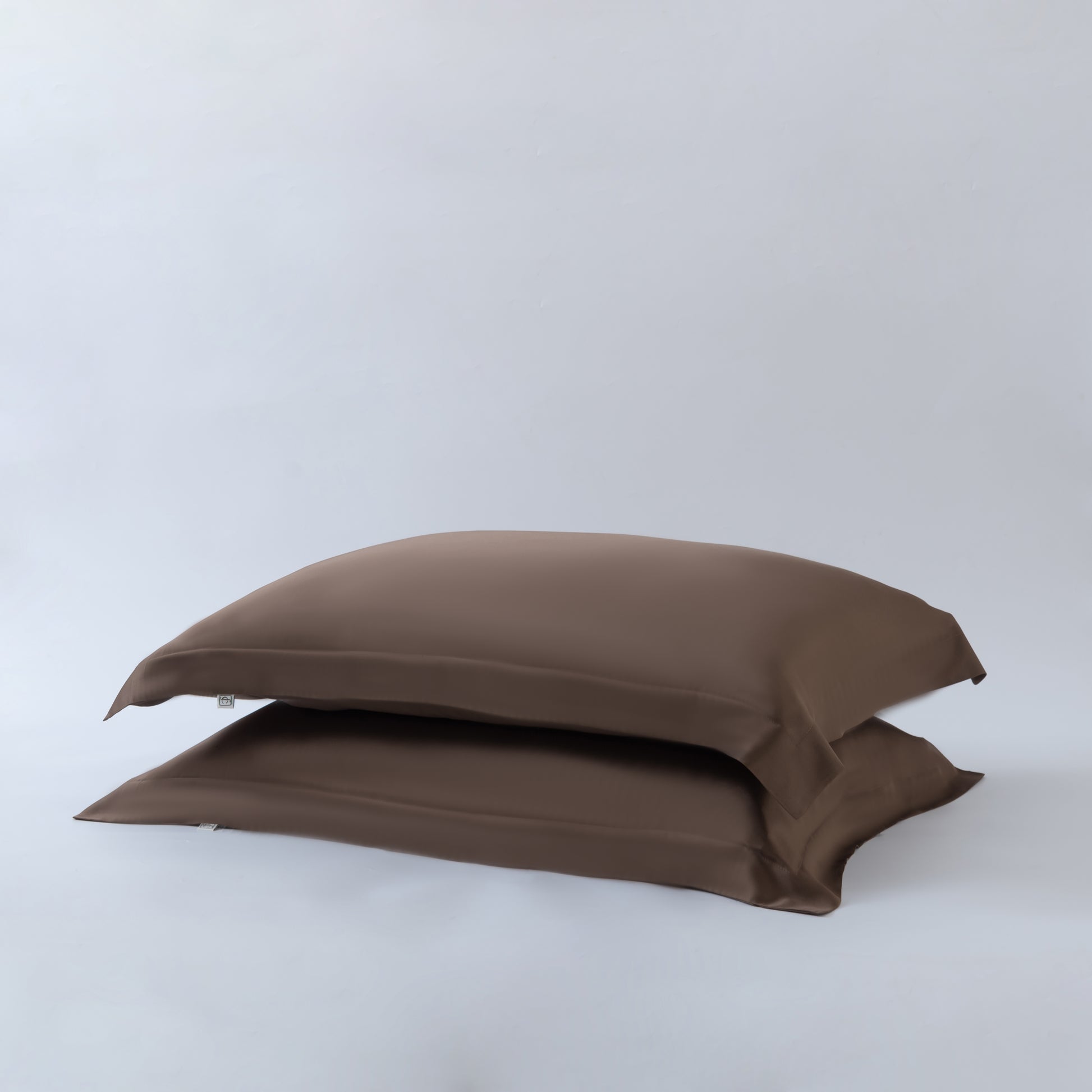 brown bamboo pillowcases in a rich earthy brown shade with a white background
