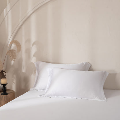 white bamboo pillowcases in a warm neutral tone for a relaxing bedroom.