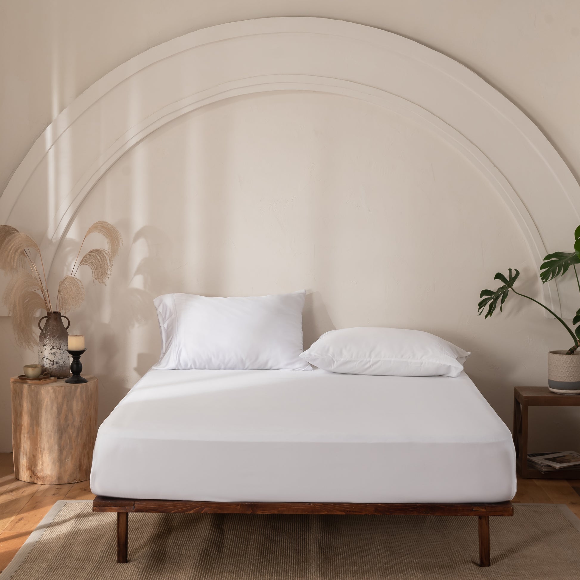 Luxury white bamboo fitted sheet styled on a modern bed