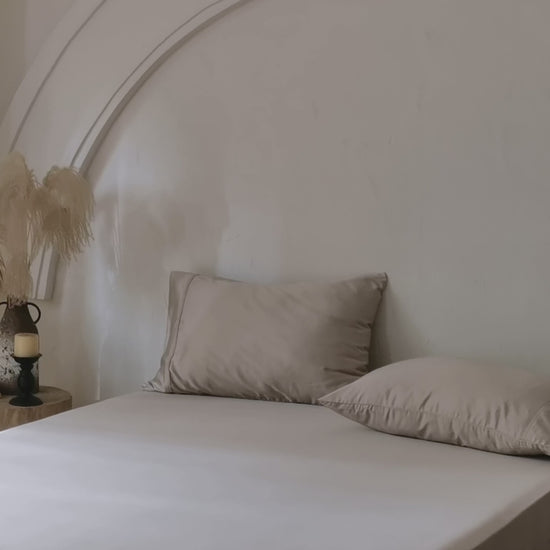 Luxury sand bamboo fitted sheet with breathable temperature-regulating fabric.
