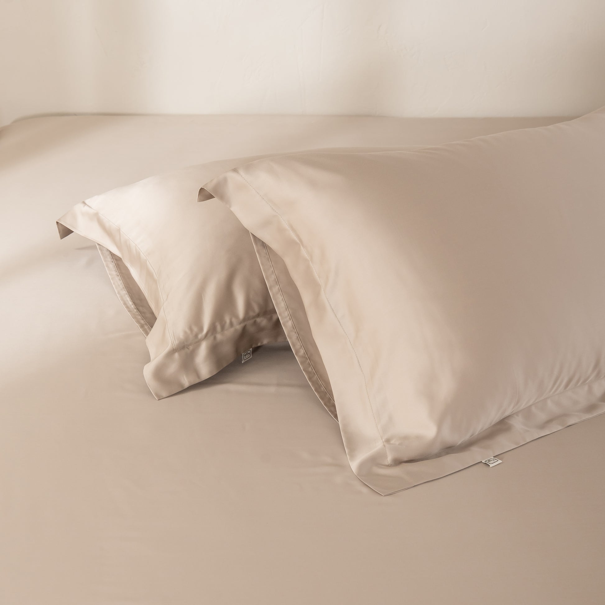Soft beige bamboo pillowcases crafted for comfort and better sleep.